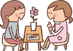 机をはさんで女性と相談員が話し合っているイラスト